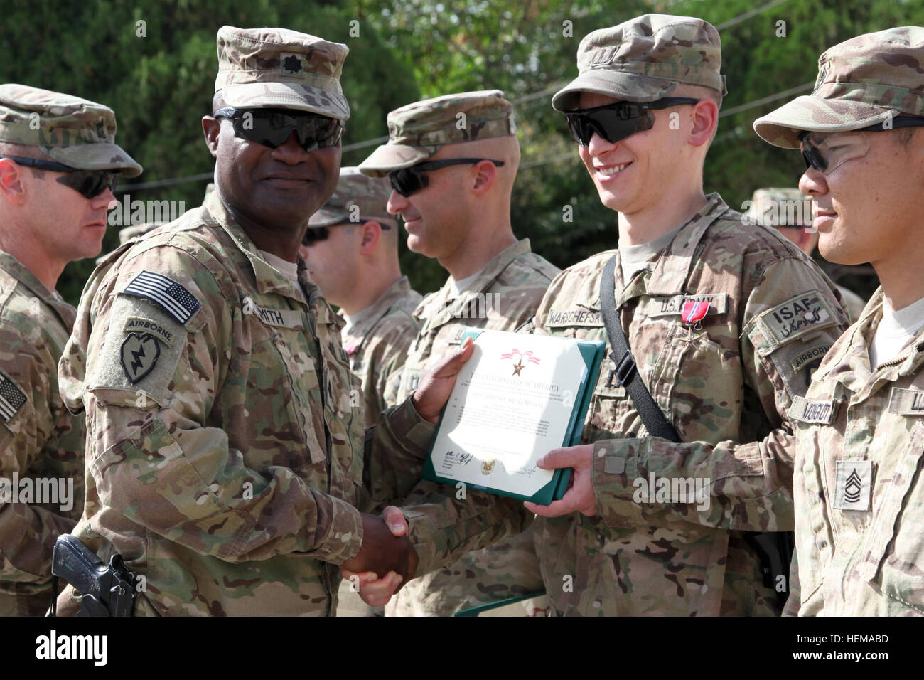 U.S. Army Capt. Thomas Warschefsky with 425th Brigade Special Troops Battalion (Airborne), Task Force 4-25, is awarded the Bronze Star by U.S. Army Lt. Col. Frank Smith, battalion commander for 425th Brigade Special Troops Battalion (Airborne), on Forward Operating Base Salerno, Khost province, Afghanistan, Sept. 24, 2012. Award ceremony 120924-A-PO167-026 Stock Photo