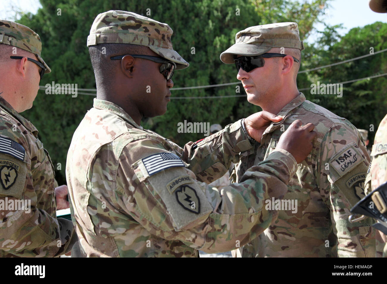U.S. Army Capt. Dawhower with 425th Brigade Special Troops Battalion (Airborne), Task Force 4-25, is awarded the Combat Action Badge by U.S. Army Lt. Col. Frank Smith, battalion commander for 425th Brigade Special Troops Battalion (Airborne), on Forward Operating Base Salerno, Khost province, Afghanistan, Sept. 29, 2012. Award ceremony 120929-A-PO167-004 Stock Photo