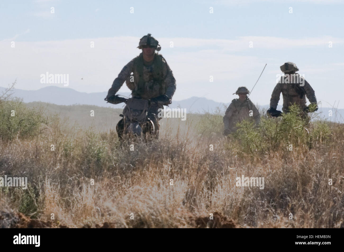 Reconnaissance Tasks Forward reconnaissance soldiers maneuver on dirt bikes through rugged ...