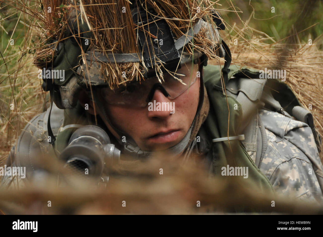 U.S. Army Pvt. Barry Snellings, an infantryman with Fox Troop, 2nd Squadron, 2nd Cavalry Regiment, occupies a security position in the woods during Operation Saber Junction near Hohenfels, Germany, Oct. 24, 2012. The Regiment engaged in a Decisive Action Training Environment rotation with multinational forces to gain a wider perspective in combat training. (U.S. Army photo by Spc. Joshua Edwards/Released) Saber Junction 2012 121024-A-ZR192-007 Stock Photo