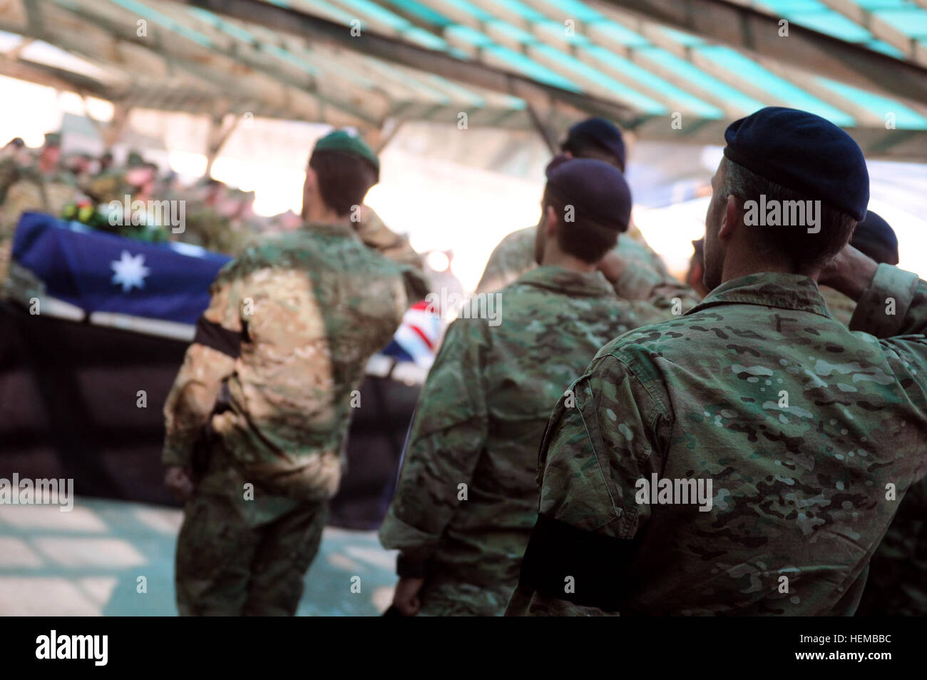 Australian soldiers honor a fallen comrade during a memorial ceremony ...