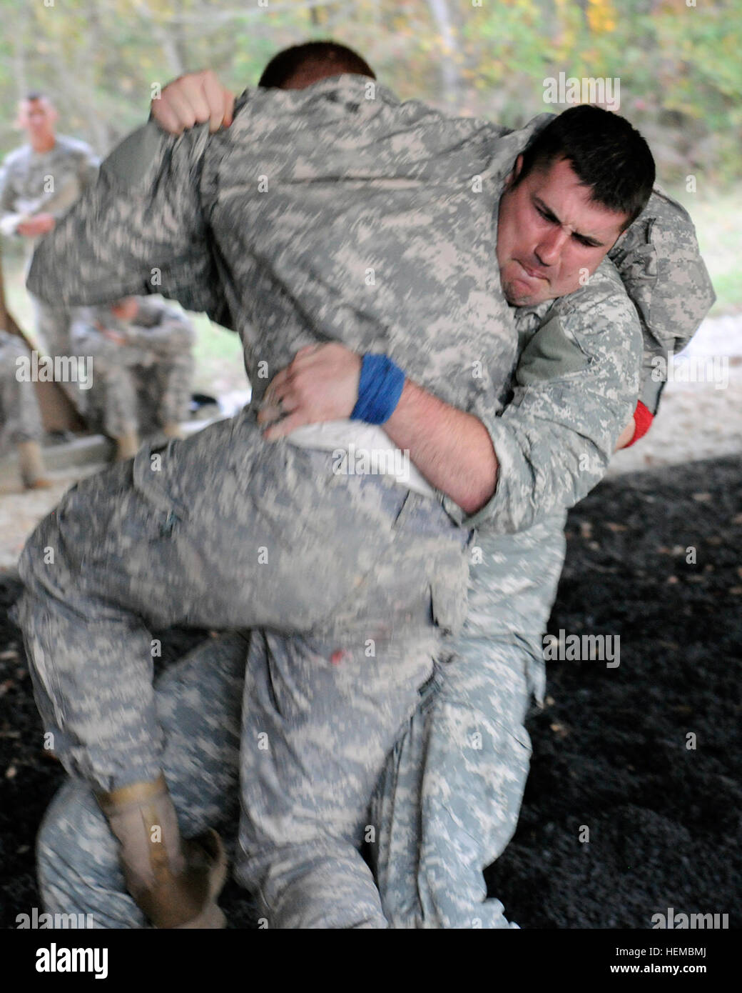 Sgt. 1st Class Thomas L. Guess (right), Jackson, Miss., of the Camp  Shelby-based 154th Regiment, lifts Spc. Charles Todd, Clinton, Miss., a  member of the 2nd Battalion, 20th Special Forces Group, during