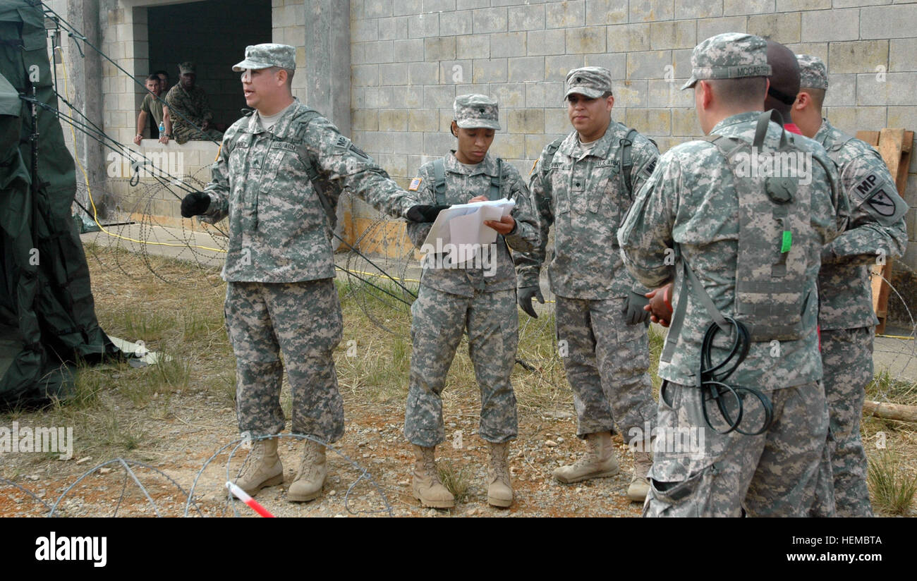 In this image, released by JTF-71 (MEB), members of the 606th Military Police Company conduct detainee training at Camp Hansen in Okinawa, Nov. 6, 2012. This annual training period enhances the unit's capabilities and keeps their military police skills fresh. Photo by Army Spc. Mario Padilla. Texas Guardsmen build international relationship through training 818174 Stock Photo