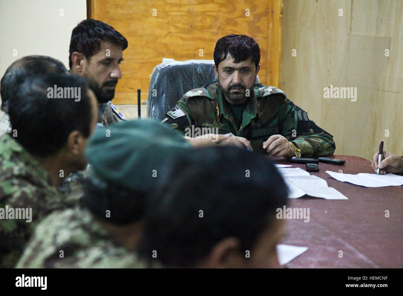 Afghan National Army (ANA) Brig. Gen. Awang looks at a map during a ...