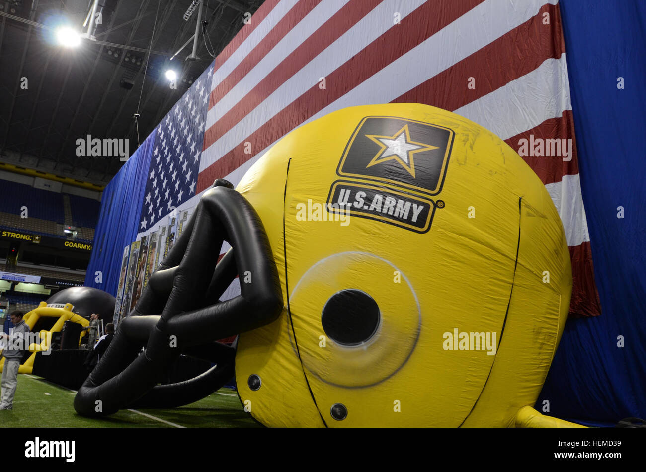 The American flag and balloon helmets, representing both teams participating in the 2013 U.S. Army All-American Bowl, were on display at the Alamodome in San Antonio Jan. 3, 2013. The displays were set up during a Texas-style barbecue dinner welcoming soldiers, student athletes and musicians, and their families. During the dinner, top high school marching band musicians, teachers and community members were recognized with awards for their accomplishments. The Army has hosted the All-American Bowl in San Antonio since 2002, highlighting the 90 best high school football players and 125 best high Stock Photo