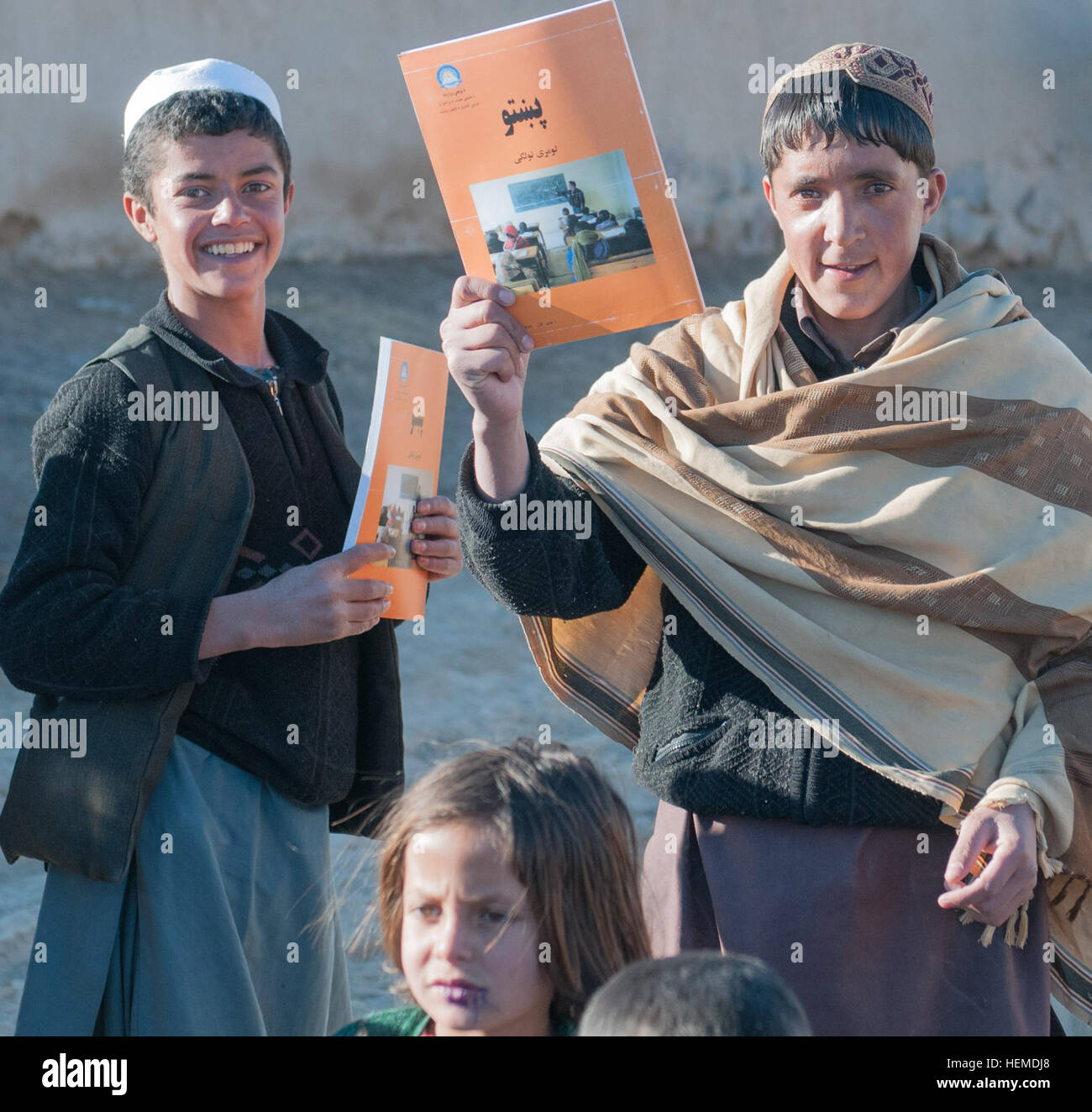 Children In The Village Of Shagowlay In Ghazni Province Hold Up Books 