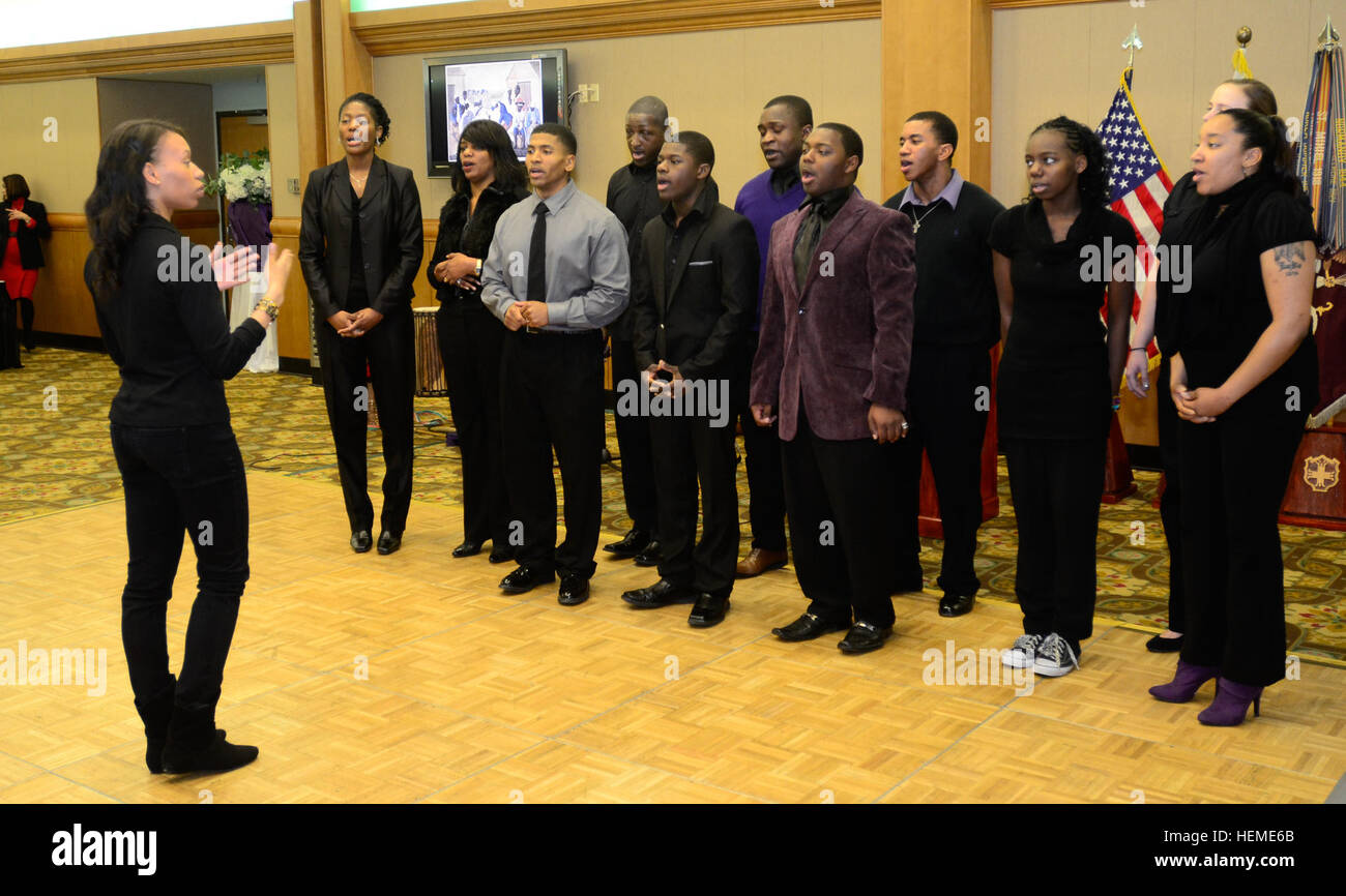 Members of the Camp Casey Chapel Choir sing the Black National Anthem during the Black History Music Festival in the Camp Casey Warriors Club at Gyeonggi province, South Korea, Feb. 8, 2013. Members of the 2nd Infantry Division jazz band played the instrumentals while the choir sang. The 302nd Brigade Support Battalion, 1st Armored Brigade Combat Team, 2nd Infantry Division sponsored the event. (U.S. Army photo by Sgt. Juan Jimenez/Released) Music, An universal language 130208-A-PX354-144 Stock Photo