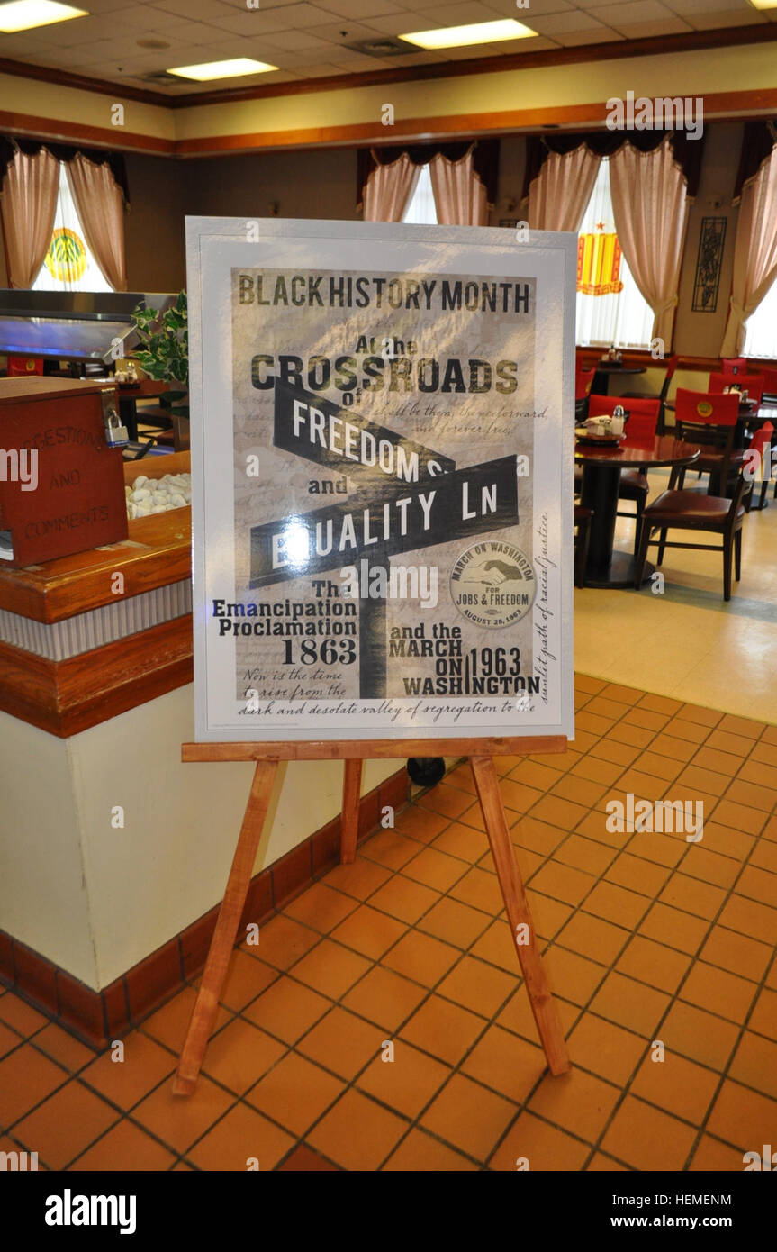 A poster commemorating Black History Month is displayed on an easel at the entrance to the 210th Fires Brigade dining facility at Camp Casey in Gyeonggi province, South Korea, Feb. 21, 2013.  (U.S. Army photo by Pfc. Han-byeol Kim/Released) Thunder Inn celebrates Black History Month 130221-A-WG463-001 Stock Photo