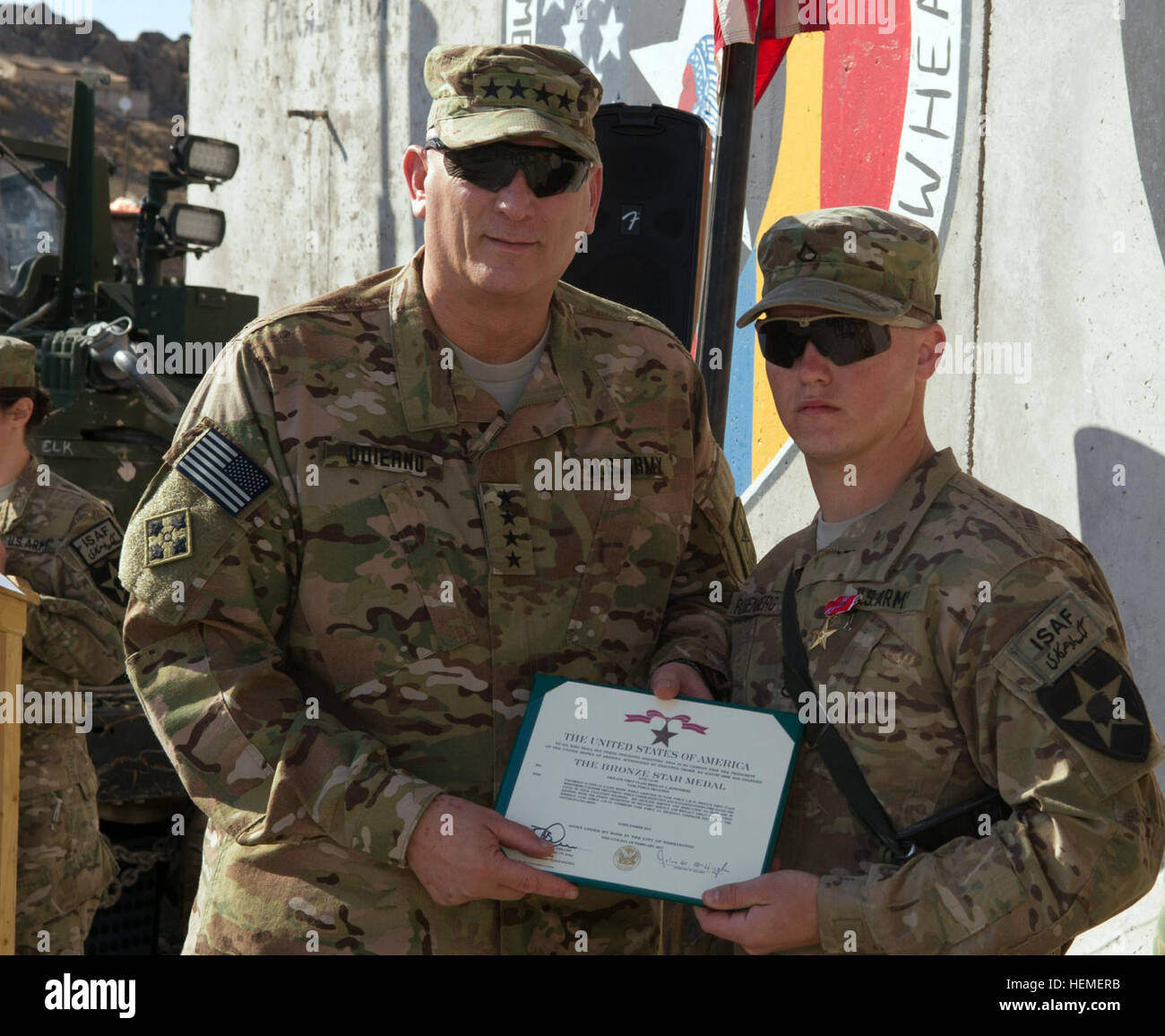Chief of Staff of the U.S. Army Gen. Raymond T. Odierno awards a Bronze Star Medal for Valor to Pfc. Brelian Rosenberg during a ceremony at Forward Operating Base Masum Ghar, Kandahar province, Afghanistan, Feb. 22, 2013. Rosenberg is a medic assigned to the 4th Stryker Brigade  Combat Team, 2nd Infantry Division. (U.S. Army Photo by Staff Sgt. Teddy Wade/Released) Odierno visits troops in Regional Command South, Afghanistan 130222-A-AO884-219 Stock Photo