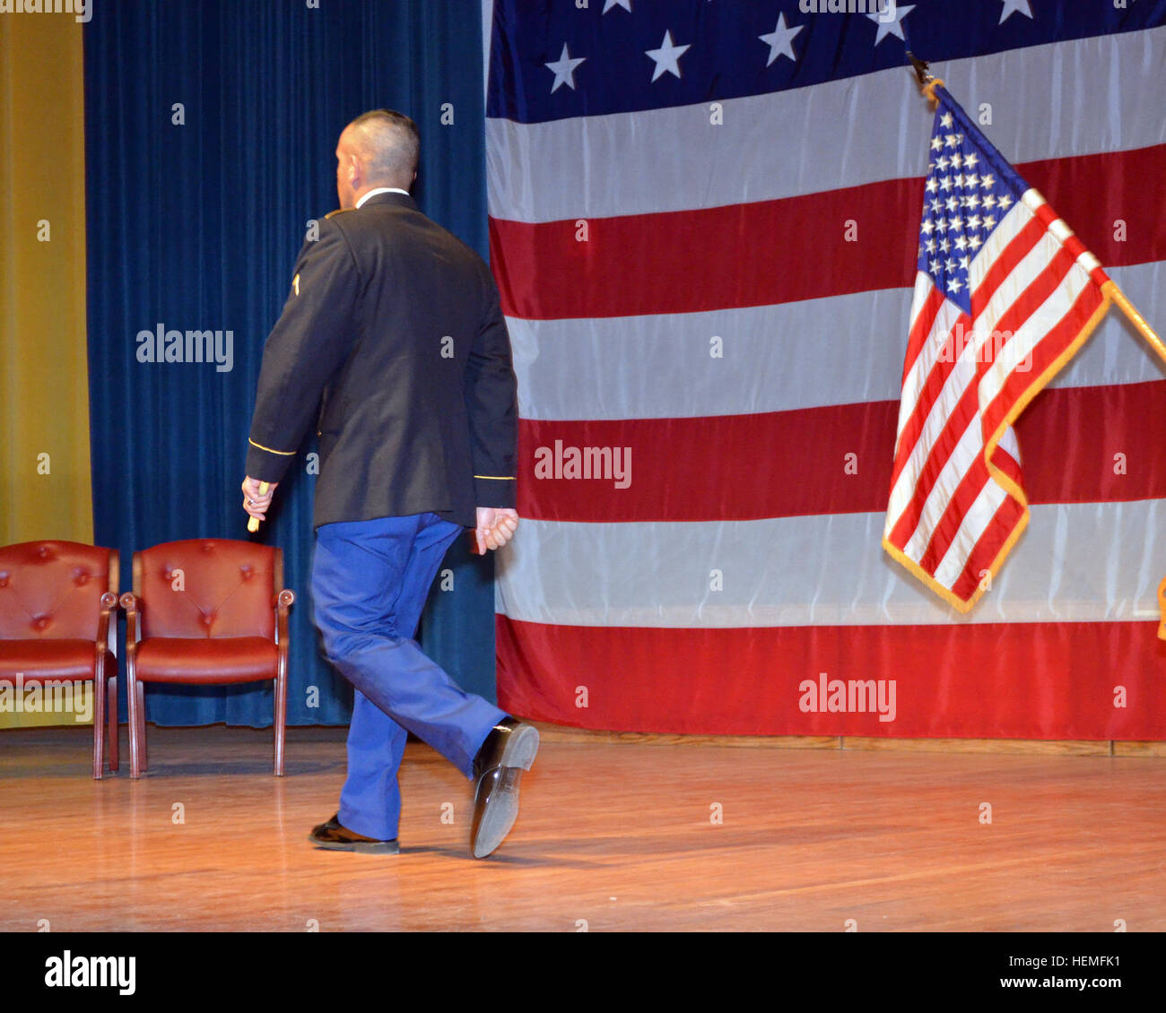 Jacob walks off the stage carrying his certificate following the