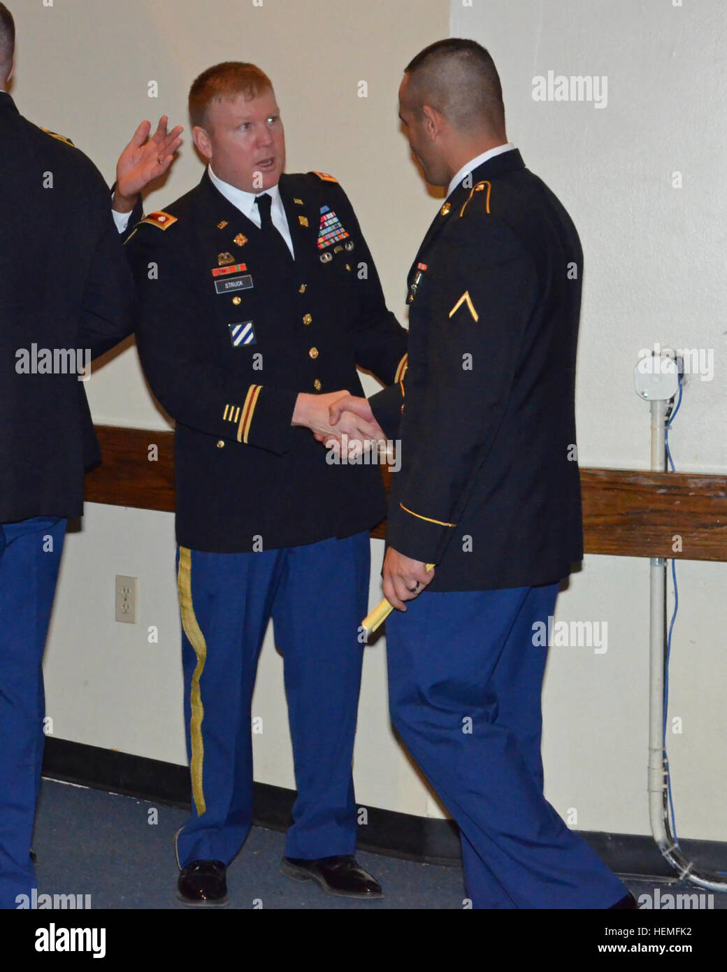 Jacob shakes hands with his battalion commander Lt. Col. Paul Struck