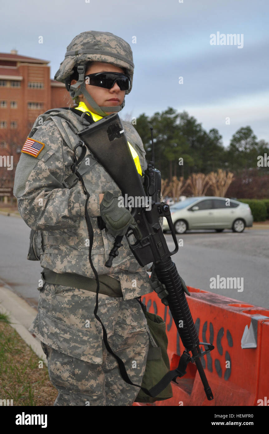 A soldier assigned to the 11th Quartermaster Company stands guard outside Womack Army Medical Center during a mass casualty exercise March 20. The 82nd Sustainment Brigade provided a security perimeter for Womack and the U.S. Army Forces Command headquarters building as part of the exercise. Providers secure Fort Bragg 130320-A-QD966-368 Stock Photo