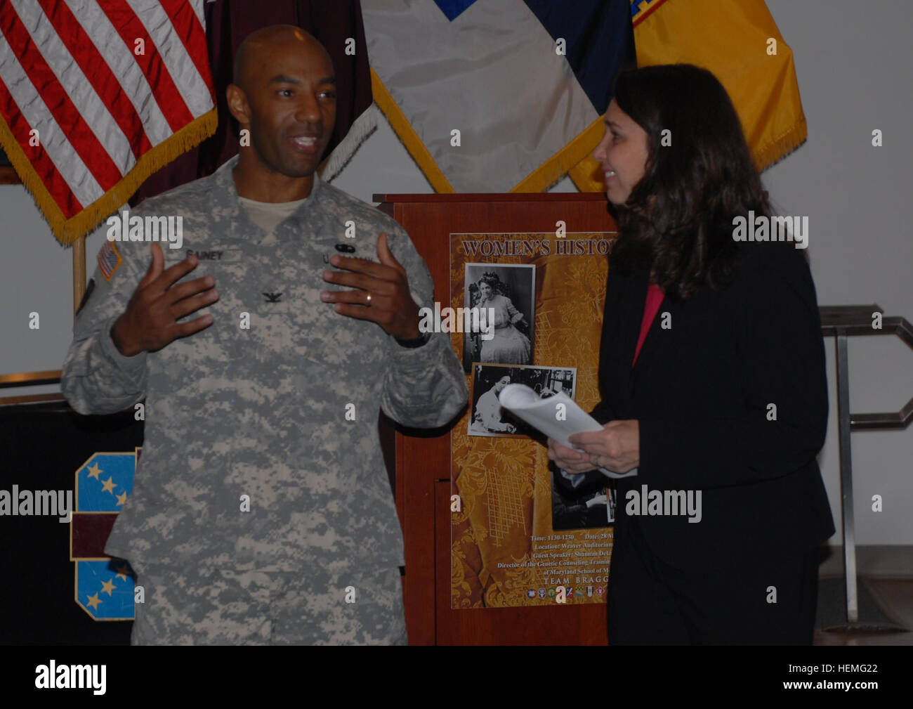 Col. Sean A. Gainey, 108th Air Defense Artillery Brigade commander, speaks with Ms. Shannan M. Dixon, director of the masters in genetic counseling training program, University of Maryland, Baltimore, during the Women's History Month Observance May 28 in Weaver Auditorium, Womack Army Medical Center. The theme this year was Celebrating Women in Science, Technology, Engineering and Mathematics. 108th ADA hosts Fort Bragg Women%%%%%%%%E2%%%%%%%%80%%%%%%%%99s History Month Observance 905742 Stock Photo