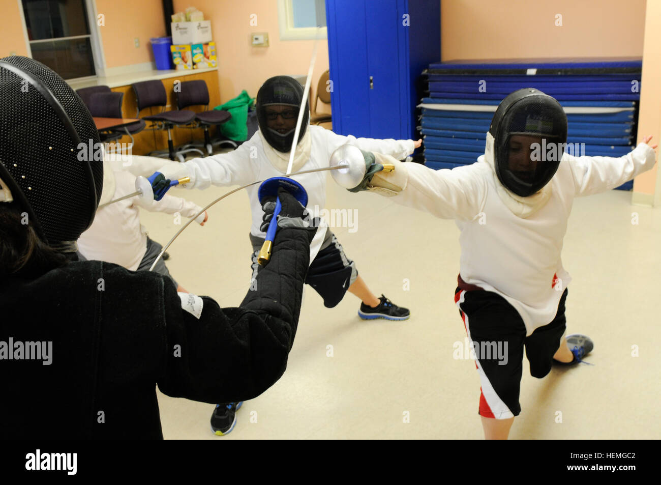 Tripp Morris practices his lunges during fencing class at Building 131