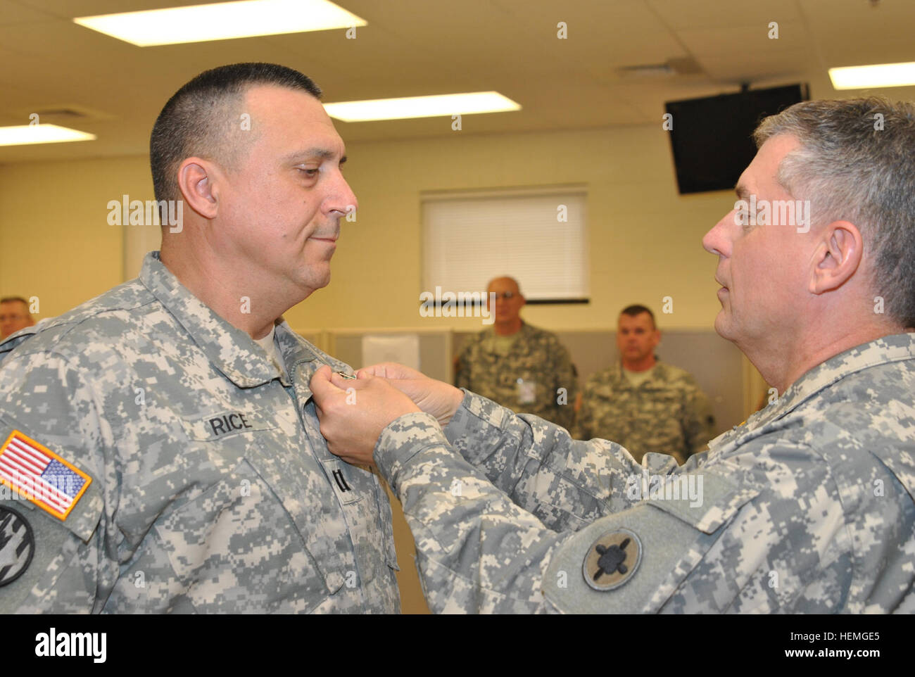 Capt. Gregory Rice receives the Army Commendation Medal for exceptional military service as commander of the 1687th Transportation Company from 184th SC Commander Brig. Gen. Janson D. Boyles during a ceremony held at CSJFTC April 7. 184th April Drill at Camp Shelby 130407-A-FQ119-005 Stock Photo
