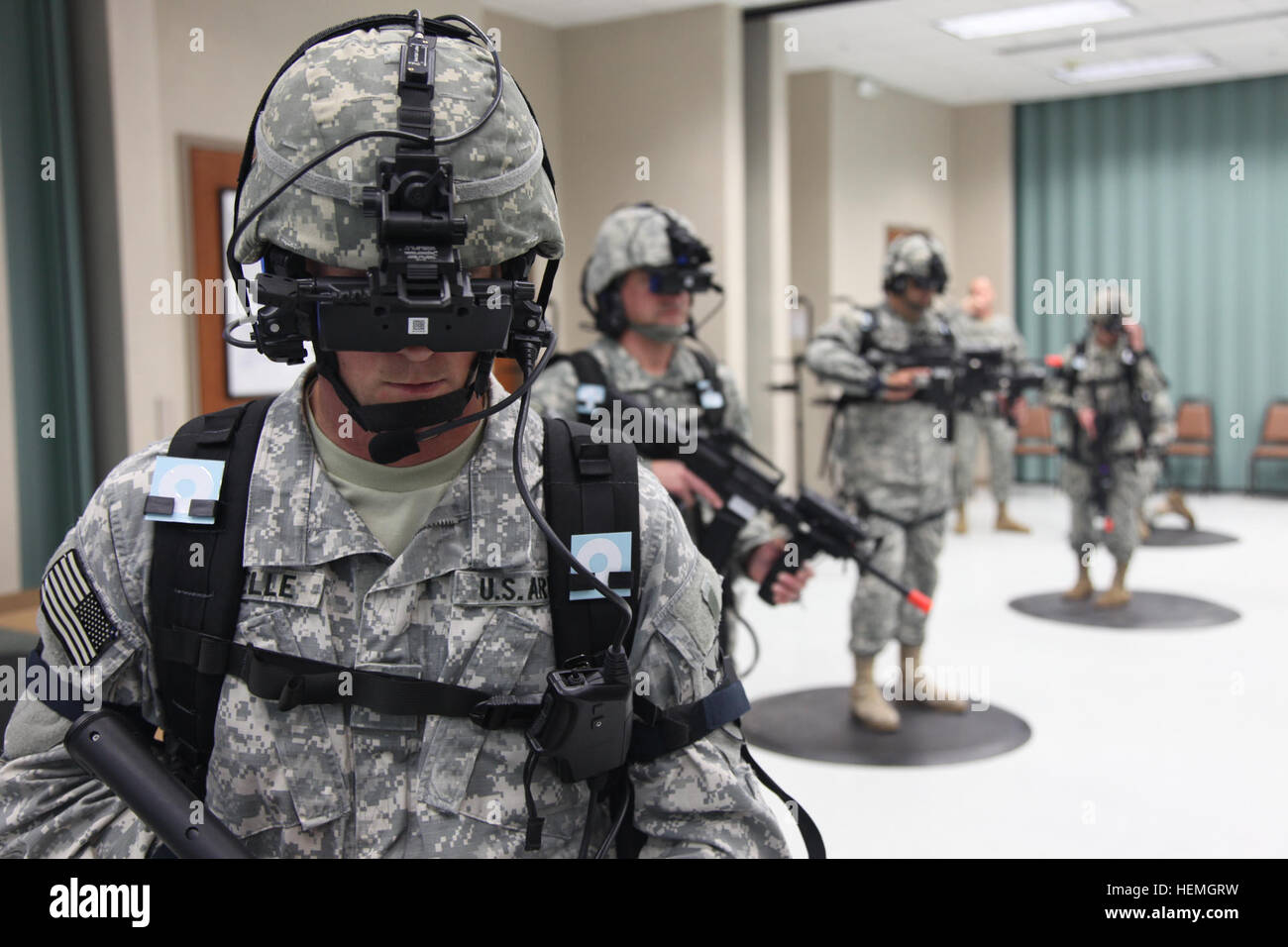 A group of U.S. Army Soldiers assigned to 4th Joint Communication Support Element (Airborne)/ 4 Joint Communication Support, are operating the Dismounted Soldier Training System in the prone position at Mission Command Training Branch Building, Fort Stewart, Ga., April 16, 2013. This training is helping Soldiers operate using a virtual environment as if they were on a real life mission on a foreign battlefield. (U.S. Army photo by Sgt. Austin Berner/Not Released) Virtual reality training 130416-A-BZ540-058 Stock Photo