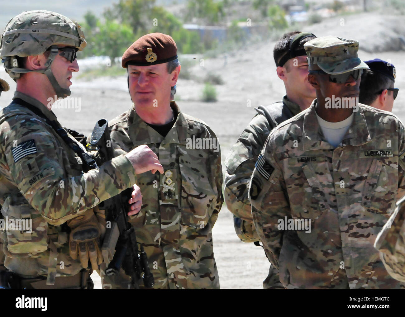 From left, U.S. Army 1st Lt. Colin Smith with the 744th Ordnance Company, 184th Ordnance Battalion, 52nd Ordnance Group, briefs British Army Gen. Sir Richard Shirreff, NATO's Deputy Supreme Allied Commander Europe, and U.S. Army Brig. Gen. Ronald Lewis, the 101st Airborne Division's deputy commanding general for support, as they observe counter-improvised explosive device awareness training at Forward Operating Base Gamberi in Laghman province, Afghanistan, April 16, 2013.  (U.S. Army photo by Staff Sgt. Richard Andrade/Released) Deputy Supreme Allied Commander Europe visits FOB Gamberi 130421 Stock Photo