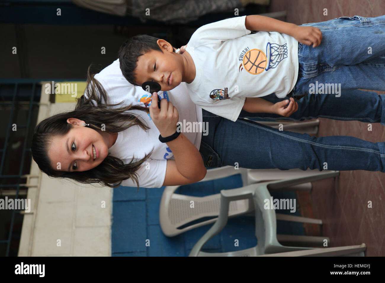 Community Vision Screening Medical personnel and volunteers conduct vision screenings at an ...