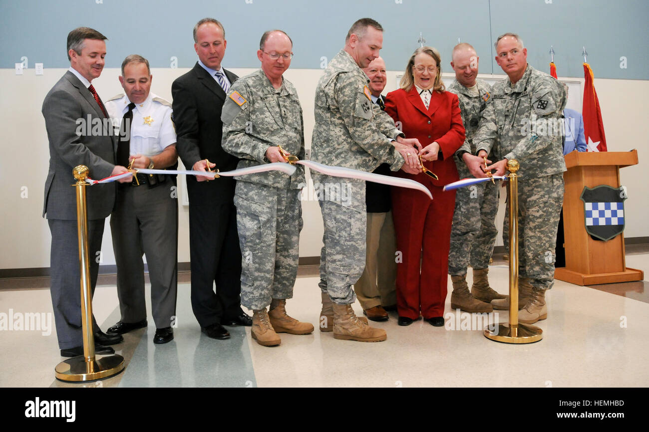 John Knapp, Virginia state director for U.S. Senator Tim Kaine, Sheriff Tony Lippa of Caroline County, David W. Storke, mayor of Bowling Green, Maj. Gen. William D. Razz Waff, commanding general of the Army Reserve's 99th Regional Support Command, Lt. Col. Peter Dargle, Fort A.P. Hill garrison commander, Army Reserve Ambassador Anthony Reed, Nancy Long, mayor of Port Royal, Command Sgt. Maj. Keith Whitcomb, Fort A.P. Hill garrison command sergeant major, and Brig. Gen. David L. Weeks, commanding general of the Army Reserve's 411th Engineer Brigade, from left, cut the ribbon during a ceremony A Stock Photo