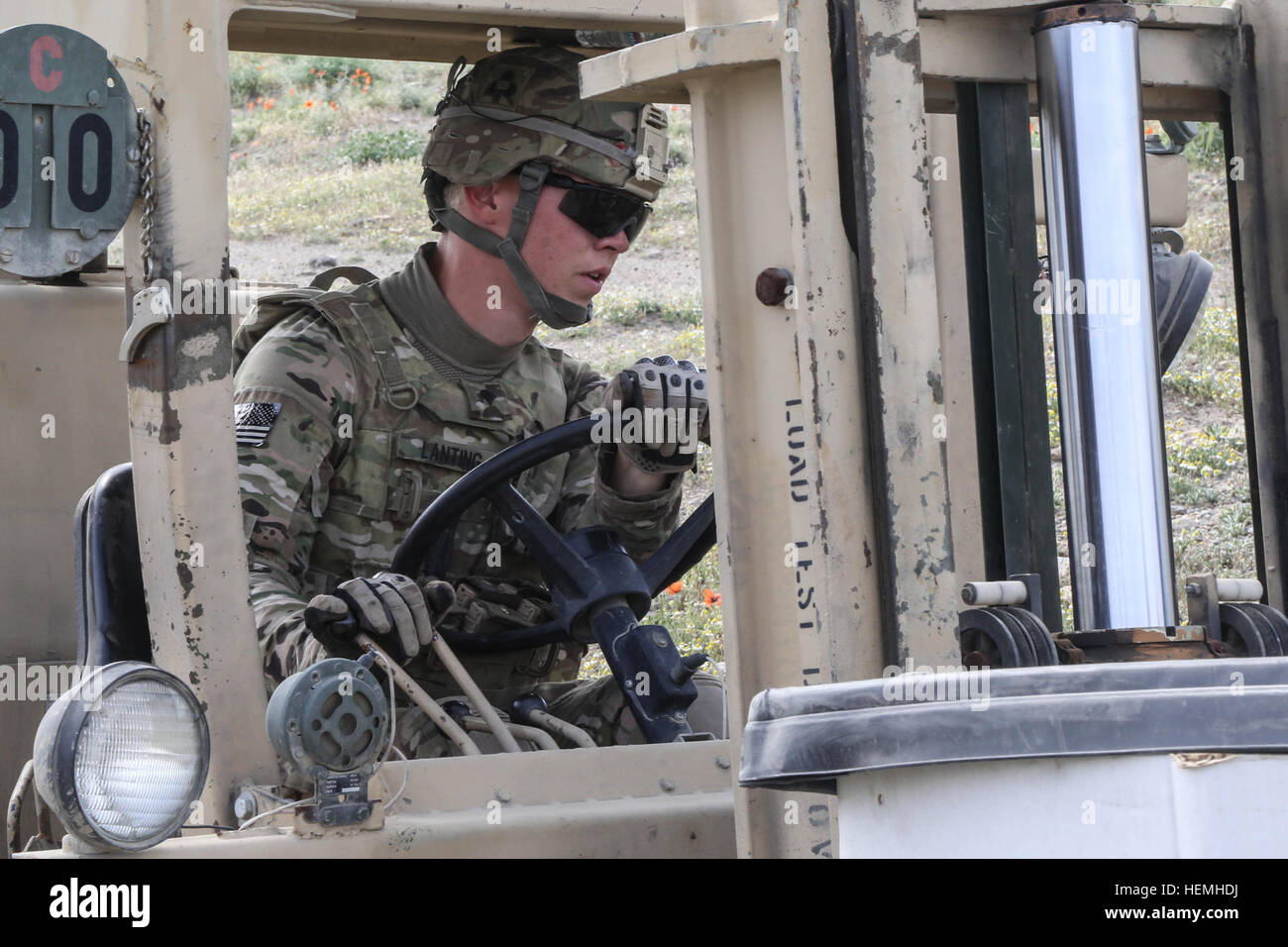 U.S. Army  Spc. Jacob Lanting assigned to Alpha Company, 426th Brigade Support Battalion, 1st Brigade Combat Team, 101st Airborne Division, operates a fork-lift to stockpile munitions during an ordnance disposal operation in the Qarghah'l district, Laghman province, Afghanistan, April 26, 2013. Soldiers from Alpha Company dispose of munitions that have been expired and are no longer safe for use or transportation. (U.S. Army photo by Spc. Vang Seng Thao/Released) OPN Jersey Aberdeen II 130425-A-WI517-688 Stock Photo