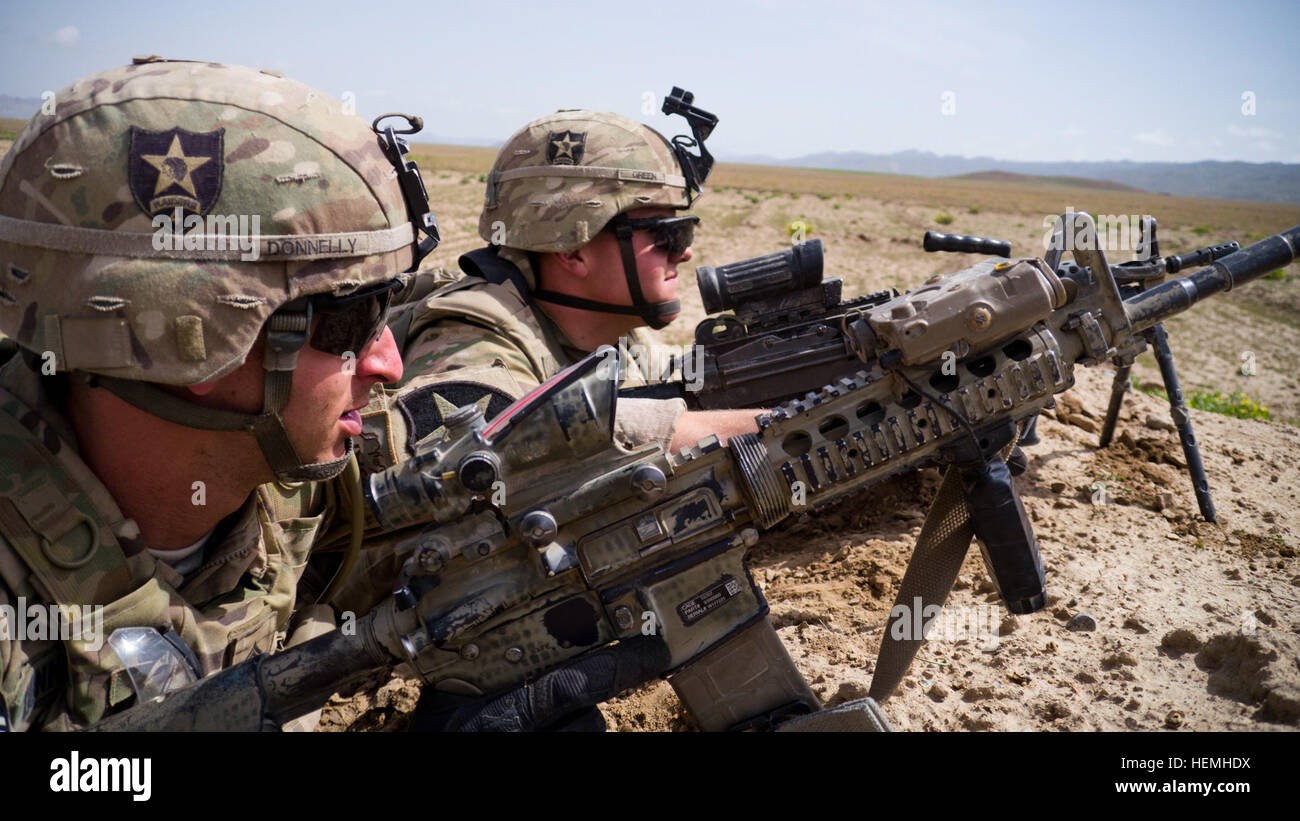 Army Sgt. Sean Donnelly (left) and Army Pvt. 1st Class Conner Green, Third Platoon, Aztec Company, Second Battalion, 23rd Infantry Regiment, 4th Stryker Brigade Combat Team, Second Infantry Division, provide over watch security for their team during an Afghan National Army led search for weapon and explosive caches in Zabul province, Afghanistan, April 25. Operation Blackhawk Talon included soldiers from 2nd Squadron, 1st Cavalry Regiment, and Afghan soldiers from the National Defense Center. (U.S. Army photo by Spc. Tim Morgan) Operation Blackhawk Talon 130425-A-QA210-305 Stock Photo