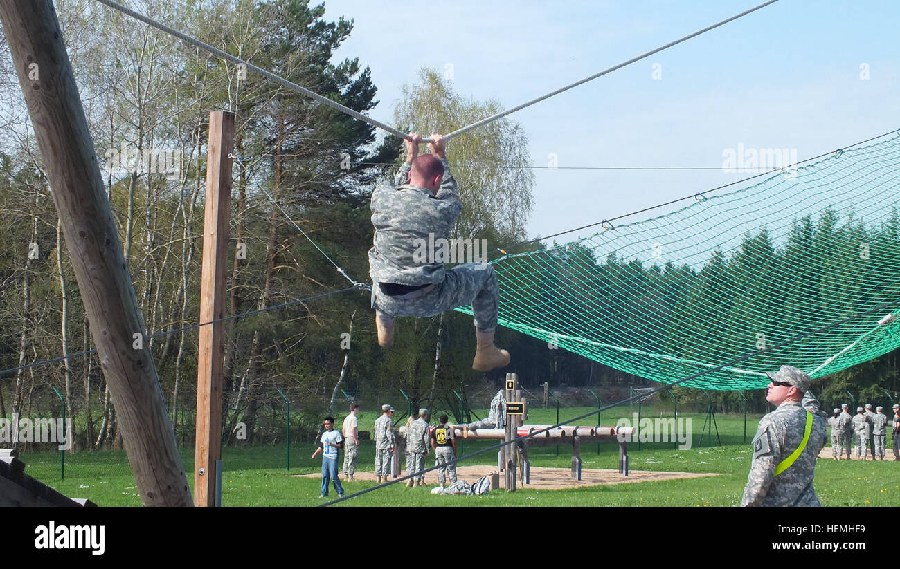 A U.S. Army Garrison Ansbach Junior ROTC cadet navigated a high rope ...