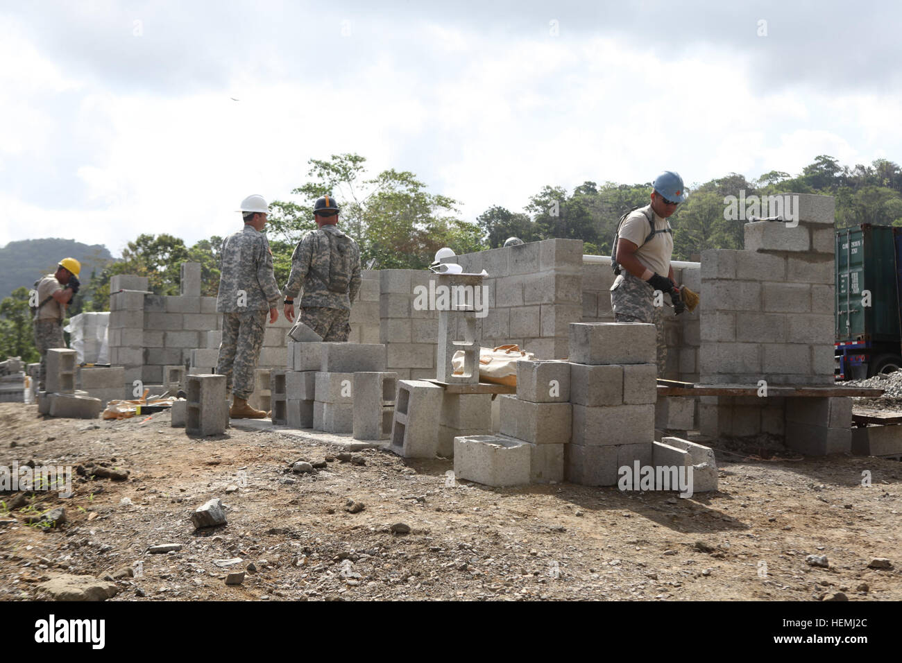 A group of U.S. Army soldiers assigned to the 302nd Engineer Company a constructing a new latrine for a local school in the town of Achiote, Colon, Panama, May 6, 2013. Beyond The Horizon 2013-Panama is a U.S. Army South exercise providing engineering and medical support to rural communities in Panama. Conducted annually, these missions are part of U.S. Southern Command's (SOUTHCOM) humanitarian and civic assistance program. (U.S. Army photo by Sgt. Austin Berner/Released) Beyond the Horizon - Combat Engineer construction 130506-A-BZ540-048 Stock Photo