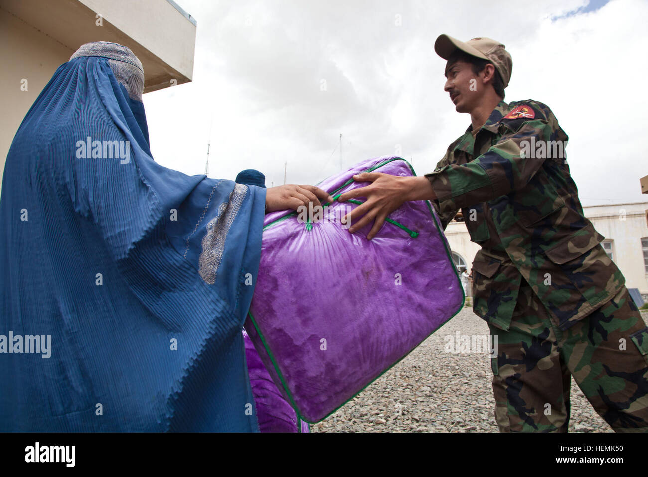 Afghan National Army Special Forces hands out humanitarian aid at a