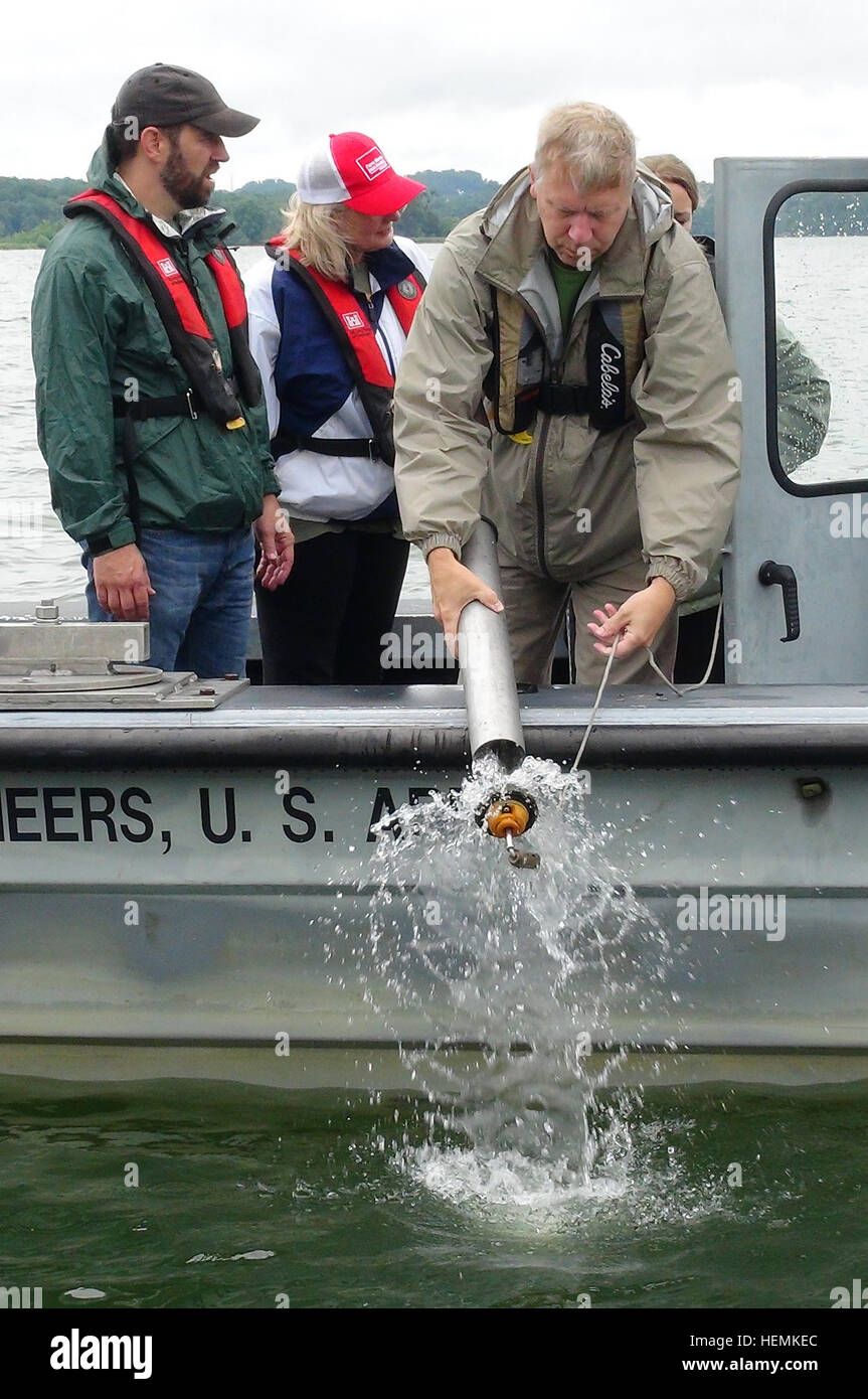 Water Management Section Chief Bob Sneed pours out excess water from a Kemmerer water sampler into J. Percy Priest Lake in Nashville, Tenn.  Members of the U.S. Army Corps of Engineers Nashville District Water Management Section showed Stratford STEM Magnet High School teachers how to collect water samples and check water quality, June 17, 2013, as part of a teacher externship to help them develop project based learning curriculum. (USACE photo by Leon Roberts) Teachers building strong STEM curriculum with corps externships 130618-A-EO110-005 Stock Photo