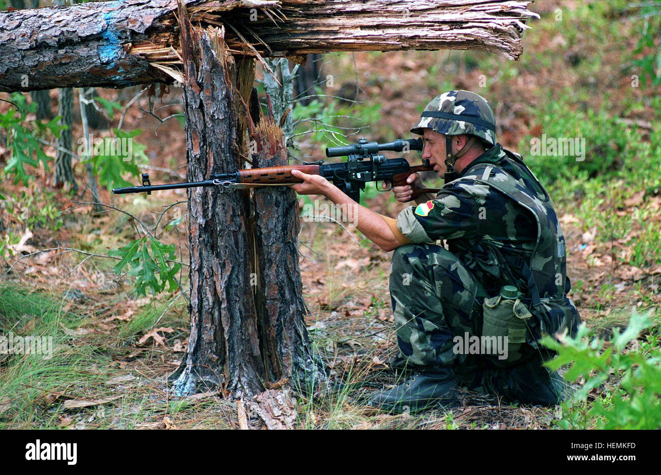 A Hungarian Soldier Aims Through The Pso 1 Telescope Mounted Atop His 7 62mm Dragunov Sniper Rifle While Kneeling Beside A Fallen Tree During Convoy Operations Training Part Of Situational Training Exercise 1 Stx 1 During