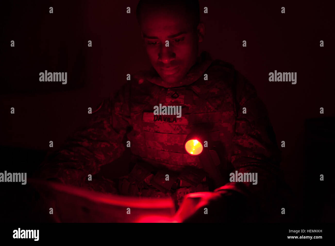 Pfc Edward Davila Walker Examines His Tactical Map During The Night 