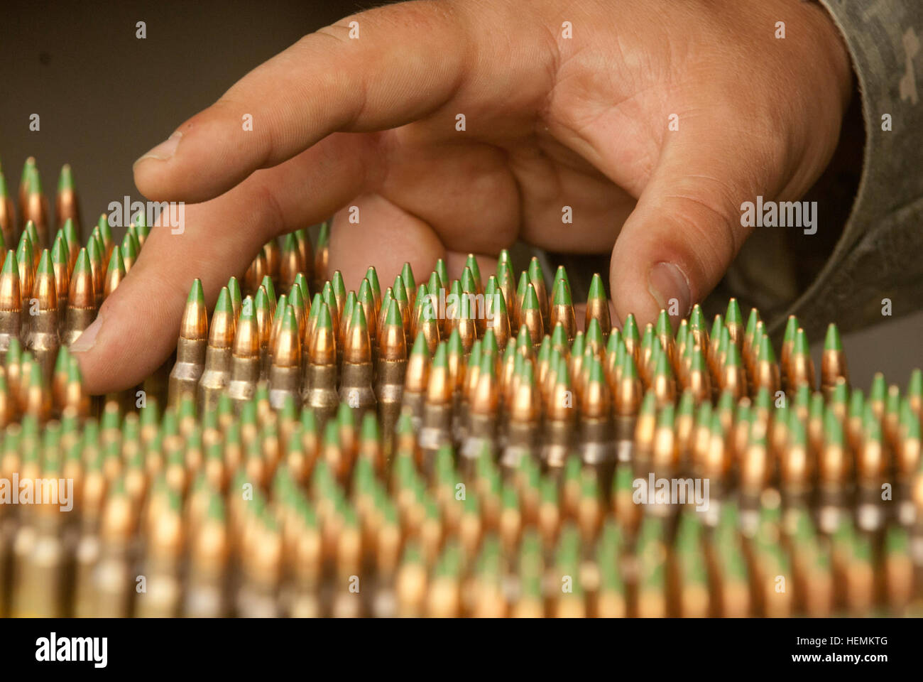 'Ammo' waits to be loaded in magazines for the M4 Qualification round ...