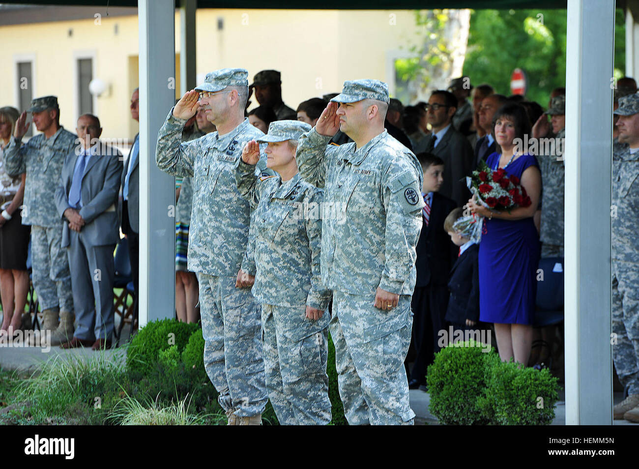 From the left, Col. Daniel W. Gall, outgoing commander of Health Clinic-Vicenza, Col. Judith A. Lee, commander, Landstuhl Regional Medical Center, Col. Andrew M. Barr, incoming commander, salute during the change of command ceremony, Caserma Ederle, Vicenza, Italy, July 9, 2013. (Photo by Barbara Romano/released) Health Center-Vicenza change of command 130709-A-VY358-004 Stock Photo