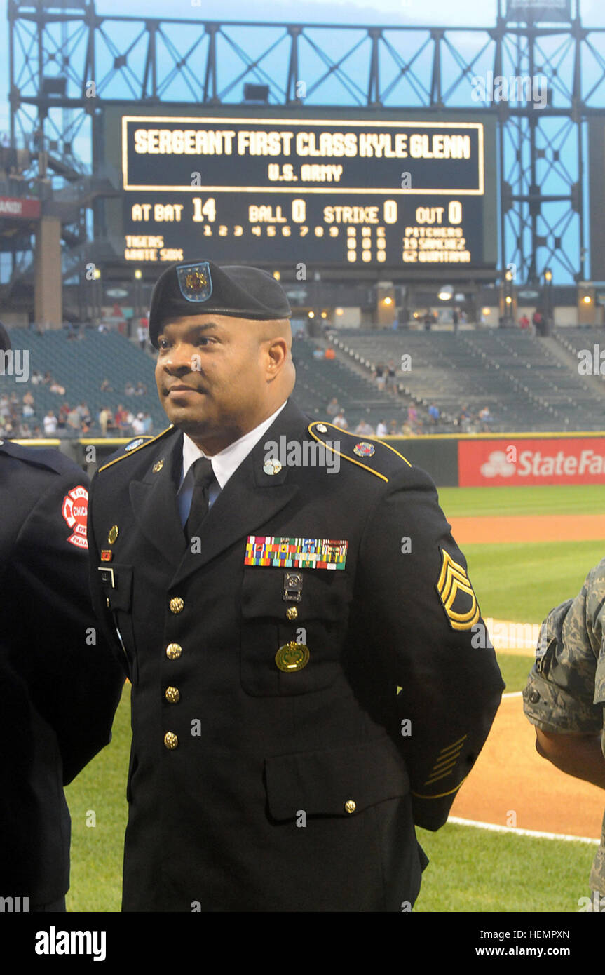 U.S. Army Sgt. 1st Class Kyle Glenn, a physical security and antiterrorism sergeant with the 85th Support Command, is recognized during a Chicago White Sox vs. Detroit Tigers National Day of Remembrance pre-game ceremony in Chicago Sept. 11, 2013. Glenn was recognized for his military service in the U.S. Army and Army Reserve, and for three deployments: Operation Desert Storm and Desert Shield in 1990, Operation Restore Hope to Somalia in 1993, and to Saudi Arabia in support effort after the bombing of Kobar Towers.  (U.S. Army photo by Sgt. 1st Class Anthony L. Taylor/Released) U.S. Army Sold Stock Photo