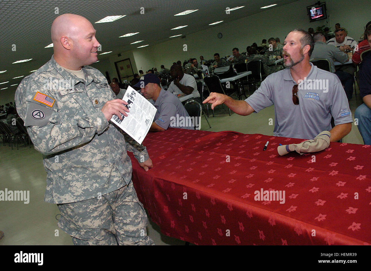 “I grew up watching the White Sox,” said U.S. Army Maj. Todd Smith, from Springfield, Ill., to Jack McDowell, a retired Major League Baseball pitcher, at Camp As Sayliyah in Qatar on Sept. 27, 2007. McDowell’s 13-year Major League Baseball tour began with the Chicago White Sox. In 1993, he won the American League’s Cy Young Award as the most outstanding pitcher. Smith brought up old memories during the pitcher’s legendary career. Jack McDowell Qatar Stock Photo