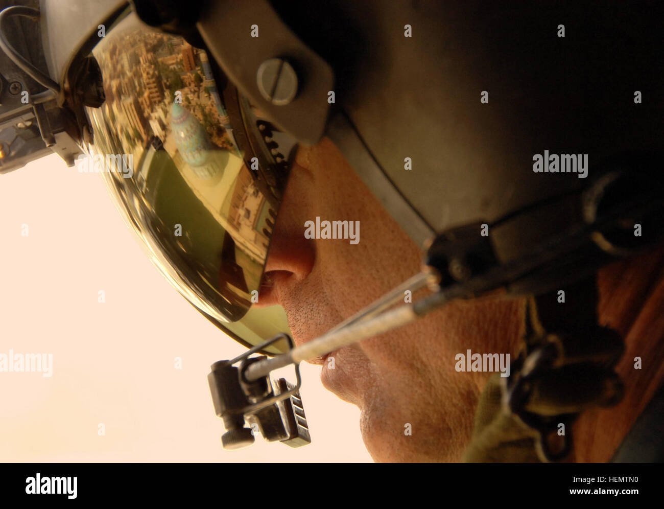 A U.S. Army sergeant first class operates an M-240 machine gun from a ...