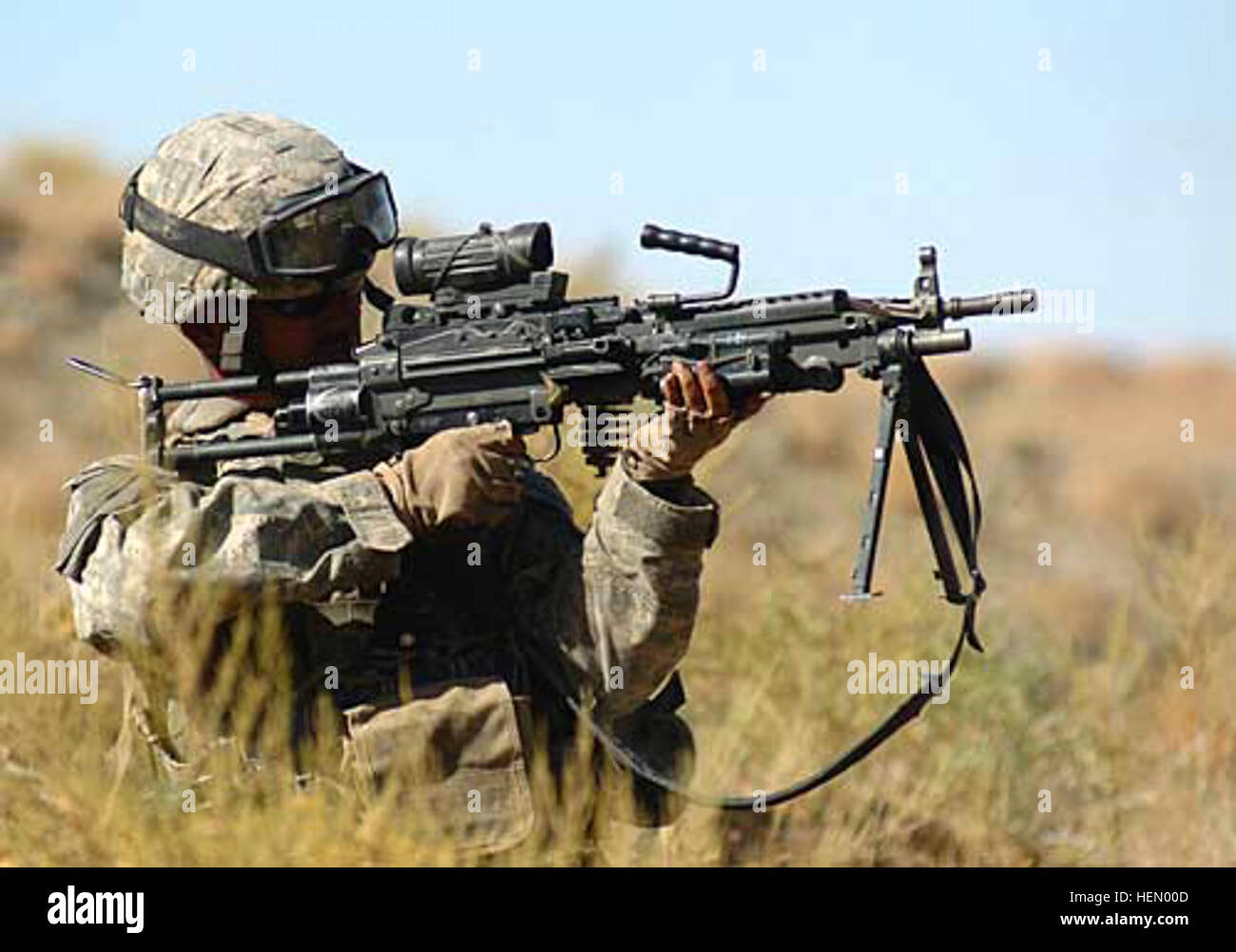 A U.S. Army soldier operates an M249 light machine gun during training ...