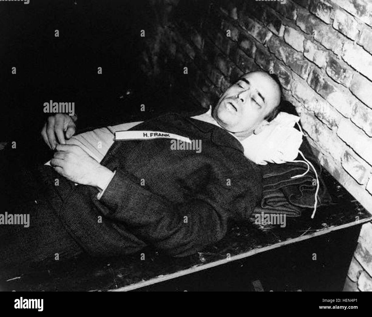 October 1946, Nuremberg, Germany --- The corpse of Nazi war criminal Hans Frank after his execution by hanging. Frank, the governor of Poland after its invasion in 1939, was judged guilty of war crimes and crimes against humanity in the Nuremburg trials. October 1946. --- Image by © CORBIS Dead hansfrank Stock Photo