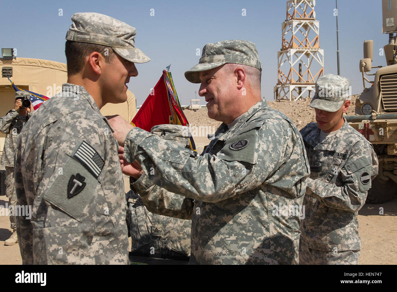 Texas Army National Guard soldier Spc. Wesley Acuna is presented the Expert Field Medical Badge by Brig. Gen. Kenneth C. Roberts, Army Central Command Assist. Chief of Staff, during a ceremony at Camp Buehring in Kuwait.  Spec. Acuna is deployed to the Middle East with the 36th Combat Aviation Brigade in support of Operation Enduring Freedom. (U.S. Army photo by Sgt. Mark Scovell/Released) Texas soldier earns Expert Field Medical Badge 101613-A-AY590-022 Stock Photo