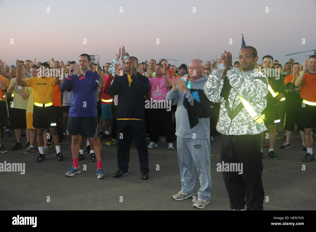 Participants clap in unison during a cancer awareness run held by the ...