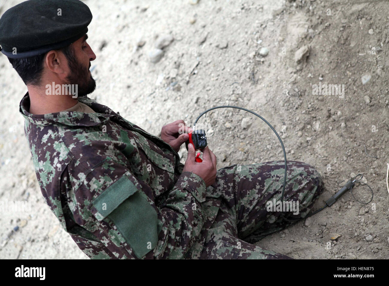 An Afghan National Army soldier prepares a secondary high explosive ...