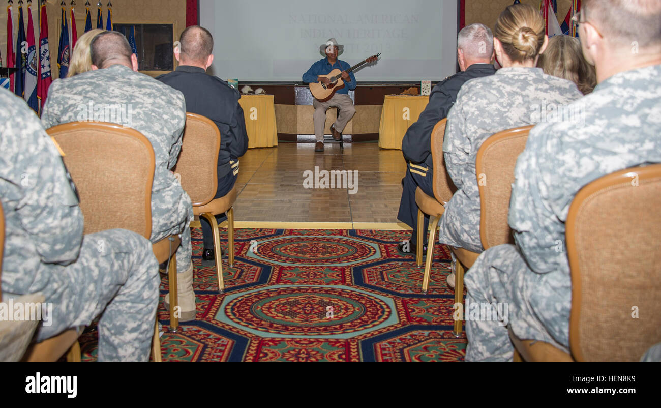 Paul 'Cowbone' Buster, a full-blood Seminole Native American, who is currently a Seminole language teacher for the Seminole Tribe of Florida education program, speaks to Soldiers of the 3rd Infantry Division at the Club Stewart ballroom here, Nov., 13. Buster was here to speak to those in attendance about Native American Heritage. The event was held in recognition of National Native American Heritage Month, and was hosted by the 2nd Armored Brigade Combat Team. Cowbone is his Seminole name given to him by his father as a right of passage from boy to young man. The theme of the event was 'Guidi Stock Photo