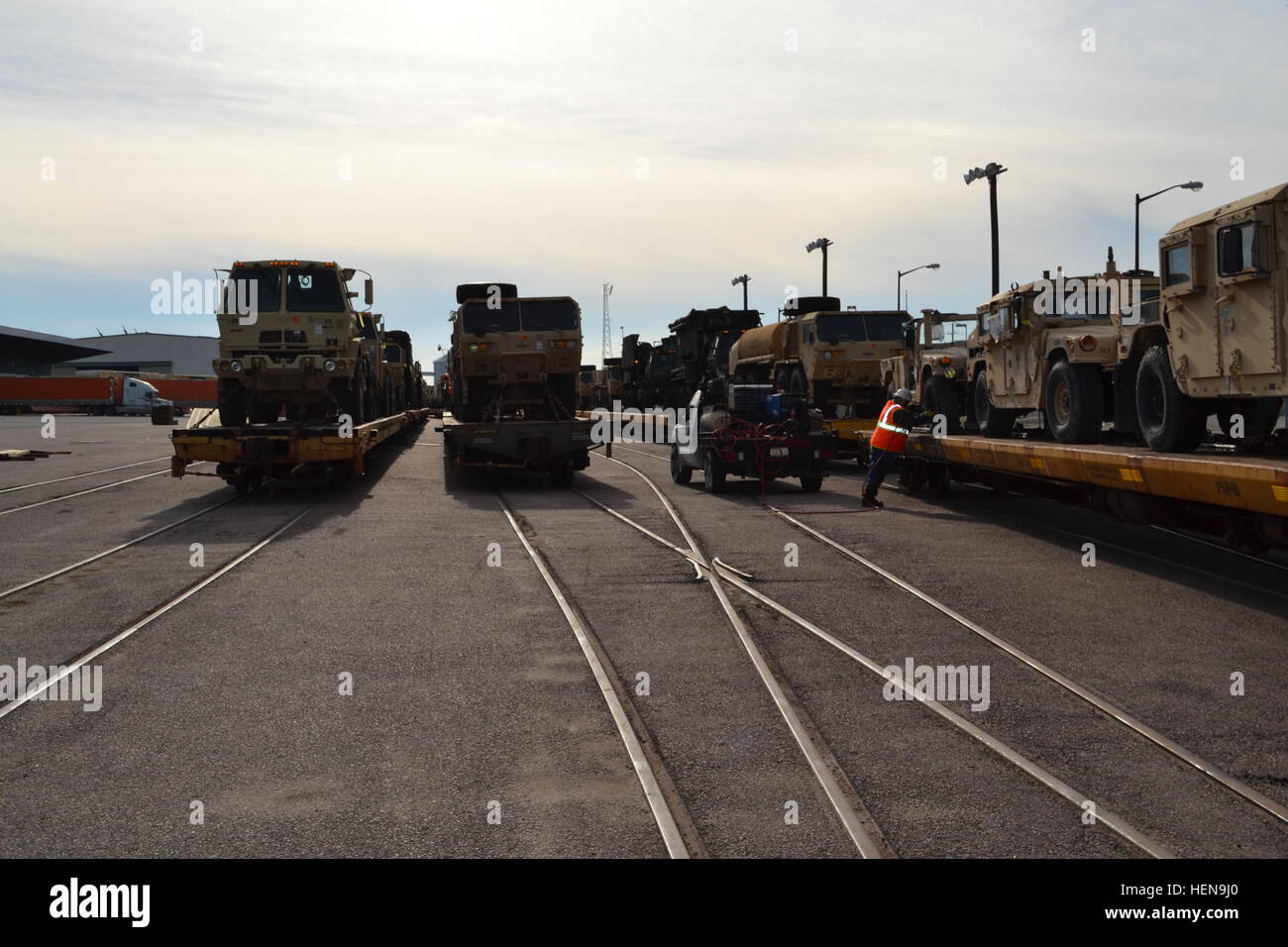 The 842nd Transportation Battalion, with the 597th Transportation Brigade, Military Surface Deployment and Distribution Command orchestrates simultaneous terminal operations for the loading of unit equipment headed overseas and the offloading of cargo returning from Afghanistan at the Port of Beaumont, Texas, Dec. 12, 2013.  (U.S. Army photo by Sarah Garner/Released)) The 842nd Transportation Battalion, with the 597th Transportation Brigade, Military Surface Deployment and Distribution Command orchestrates simultaneous terminal operations for the loading of unit equipment 131212-A-TQ663-647 Stock Photo