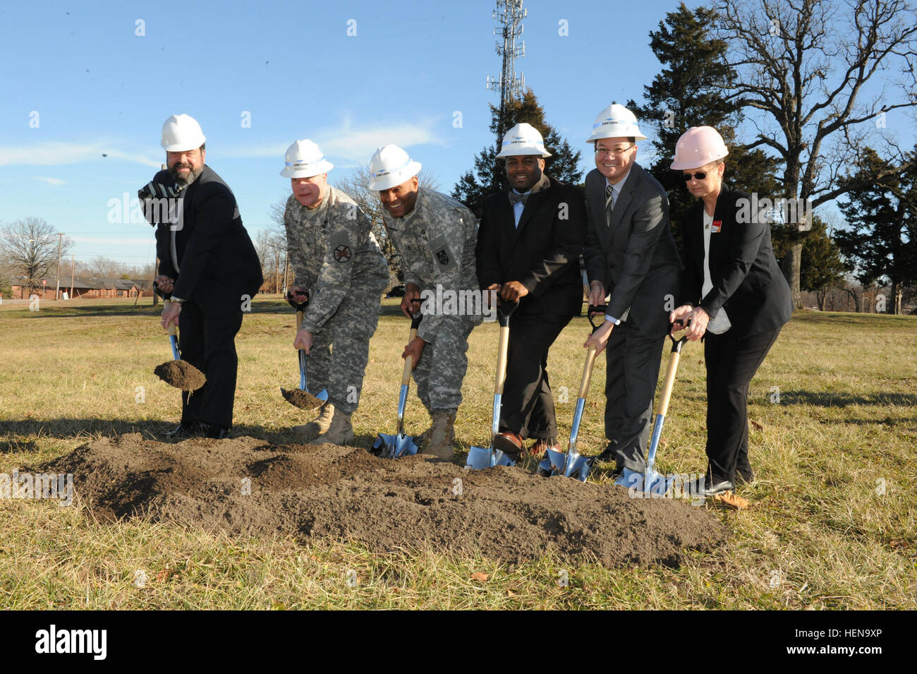 From left to right: Bobby Rakes, Directorate of Public Works director; Col. William Pfeffer, Garrison commander; Maj. Gen. Leslie Smith, Maneuver Support Center of Excellence and Fort Leonard Wood commander; Will Radford, Lend Lease development manager, Arthur Holst, IHG operations vice president; and Susan Sielky, IHG Fort Leonard Wood general manager, break ground for construction to begin on the new Candlewood Suites hotel. Candlewood Suites is projected to be finished in fall of 2015. The hotel will replace the Sturgis facility. Post breaks ground on lodging tailor-made for troops 131218-A Stock Photo