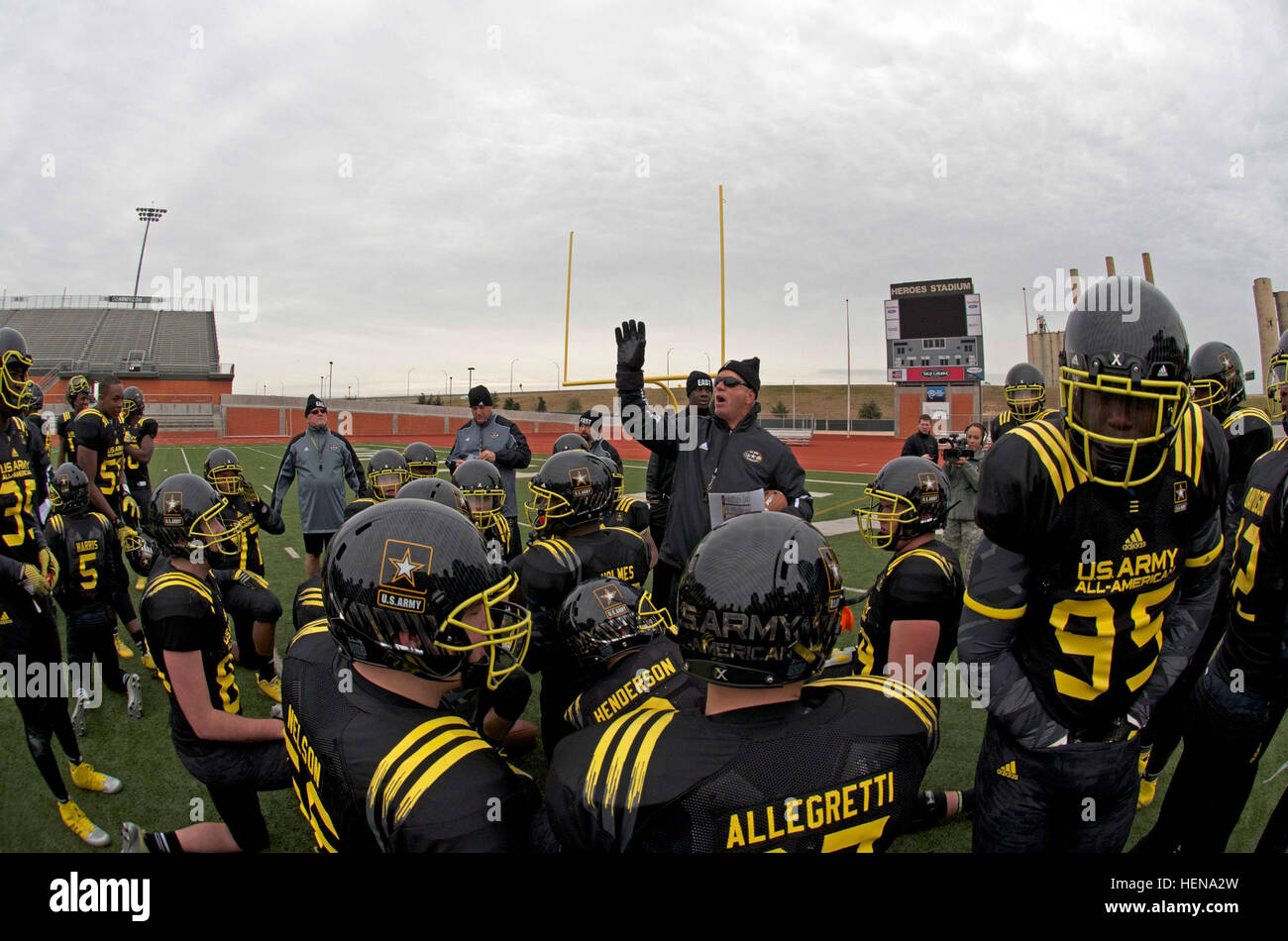 Head Coach of the 2014 U.S. Army All-American Bowl East Team, Bob Sphire, from North Gwinnett High School, Suwanee, Ga., speaks to his entire team at a short break during East Team's first practice at Heroes Stadium in San Antonio, Dec. 30, 2013. The U.S. Army All-American Bowl is the premier high school football event in the country, featuring more than 90 of America's best senior high school football players competing in an East vs. West game, occurring this year, Jan. 4, 2014. In 2013, the bowl drew a crowd of 40,133, the largest to date. (U.S. Army Reserve Photo by Pfc. Thomas C. Love, 205 Stock Photo