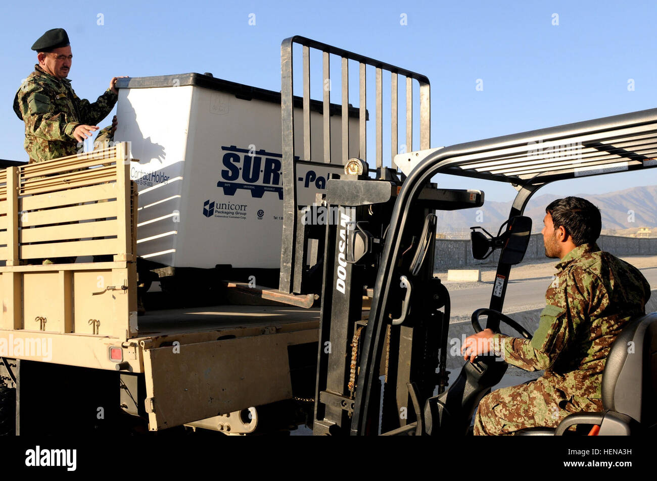 The 201st Afghan National Army Corps soldiers move kicker boxes filled
