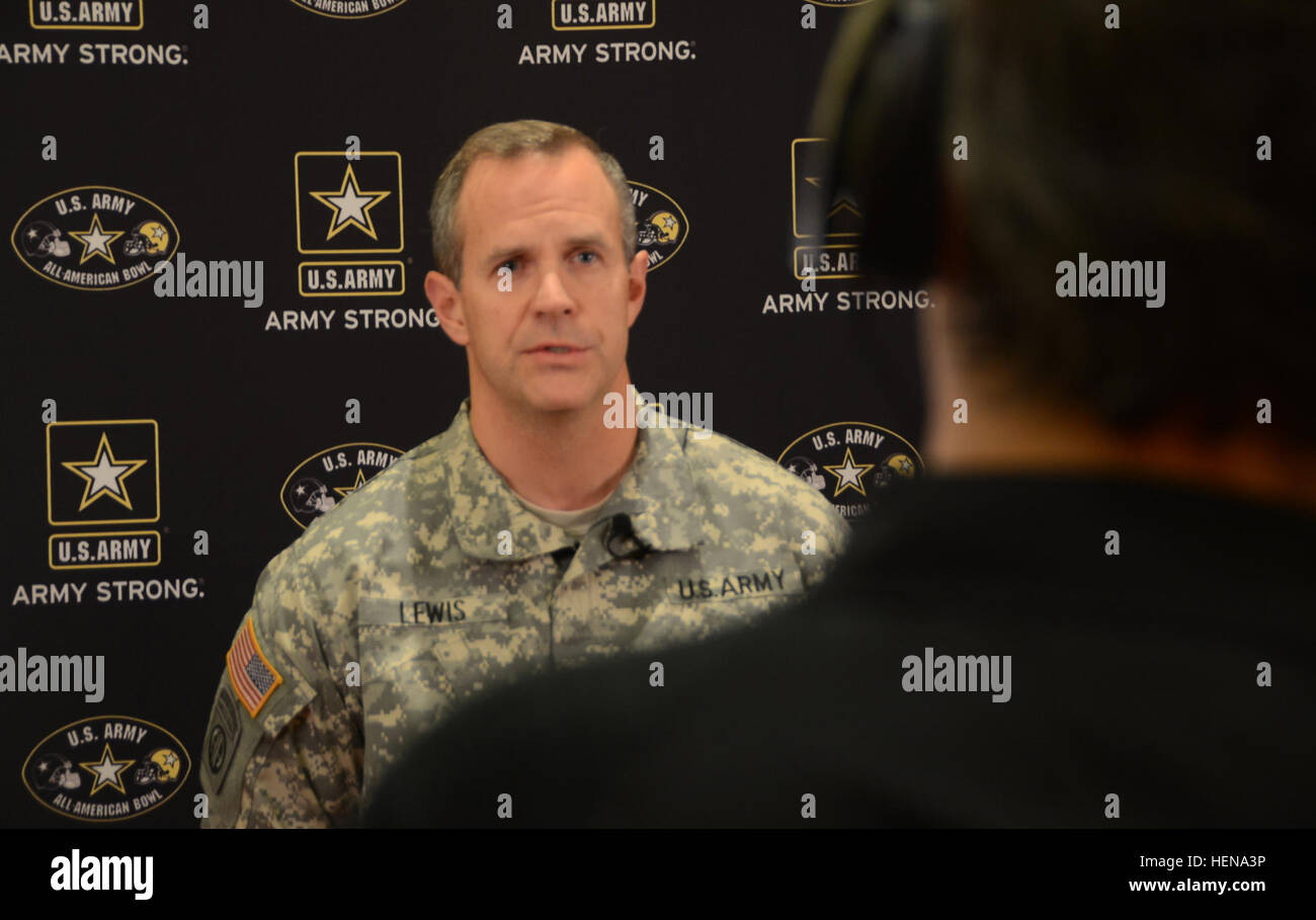 Sgt. 1st Class Matthew R. Lewis, a native of Houston, takes part in an interview with a local media outlet during All American Bowl week in San Antonio, Jan. 1, 2014. Lewis is a communications sergeant with the 10th Special Forces Group (Airborne) at Fort Carson, Colo. Lewis and nine other soldiers from the U.S. Army Special Operations Command are in San Antonio as soldier mentors to 90 of the nation's top high school football stars, along with 125 top high school marching band musicians and Color Guard members. The weeklong event culminates with the Army's All American Bowl football game, the Stock Photo