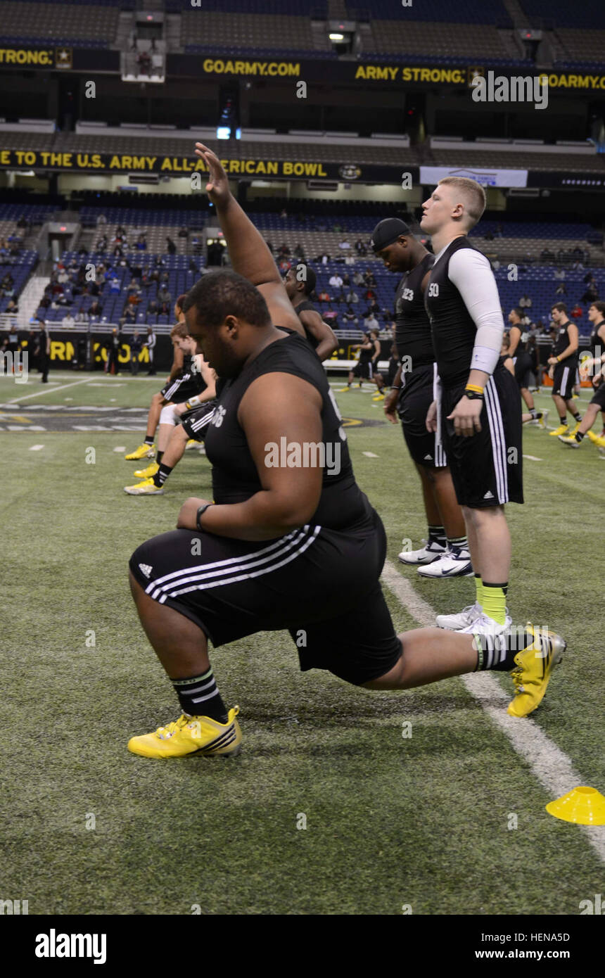 High school football players stretch after the 2014 U.S. Army All-American Combine at the Alamodome in San Antonio Jan. 3, 2014. High school junior and sophomore football players come from all over the country for a chance to play in the 2015 U.S. Army All-American Bowl. (U.S. Army Reserve photo by Spc. Victor Blanco, 205th Press Camp Headquarters/2014 U.S. Army All-American Bowl JIB) Getting loose at the combine 140103-A-GX635-130 Stock Photo