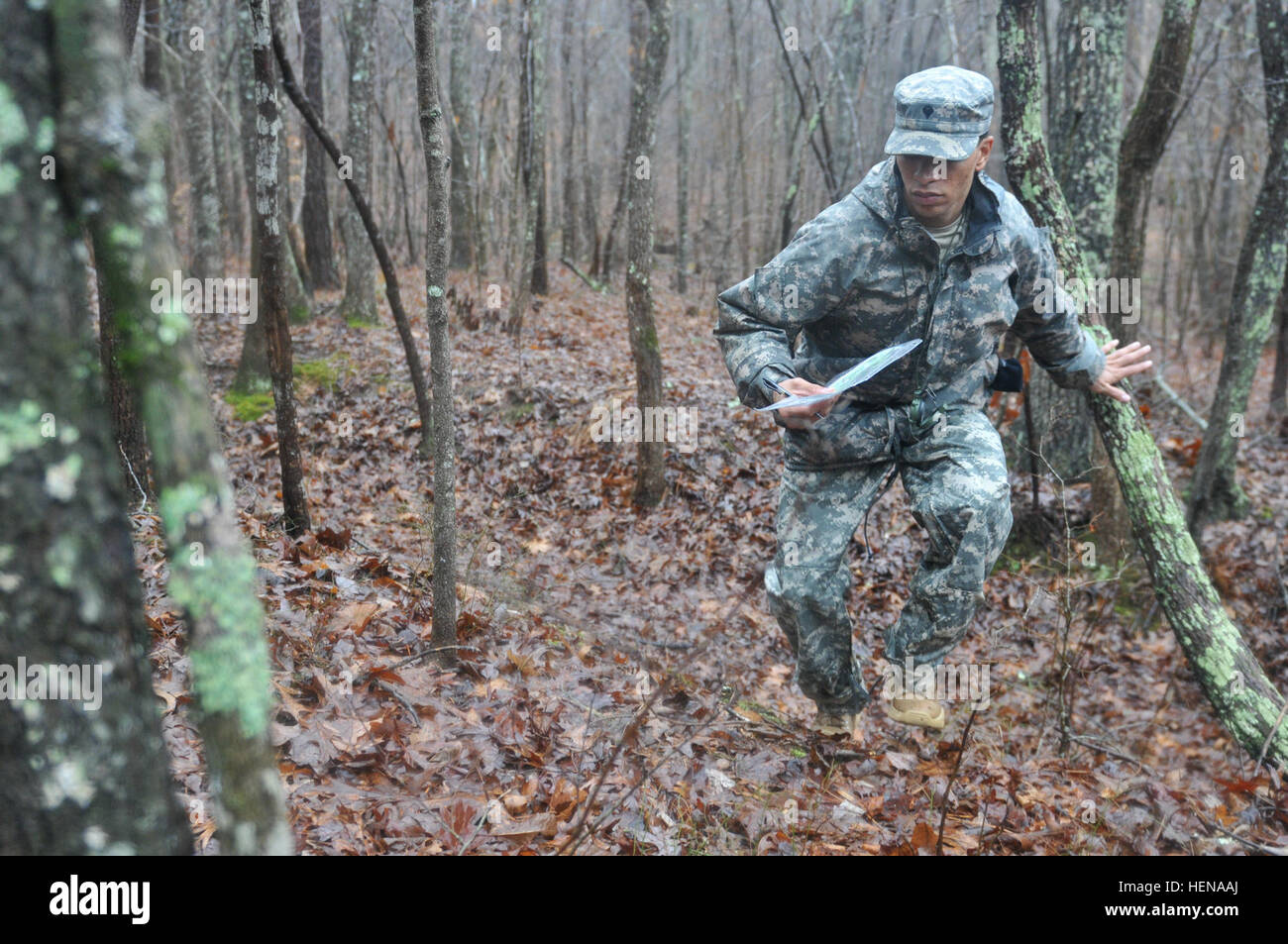 Spc. Phillip B. Hogan, a wheeled vehicle mechanic assigned to the 175th Support Maintenance Company, 812th Transportation Battalion, 518th Sustainment Brigade, 143rd Sustainment Command (Expeditionary), competes in the land navigation portion of the brigade's Best Warrior Competition, here Jan. 11. From Jan. 9-12, the Spartanburg, S.C., native will have competed against the brigade's best soldiers in the areas of physical fitness, marksmanship, land navigation, and written and oral examinations. The winner of this competition will move on to the 143rd ESC competition of the same name. (Photo b Stock Photo
