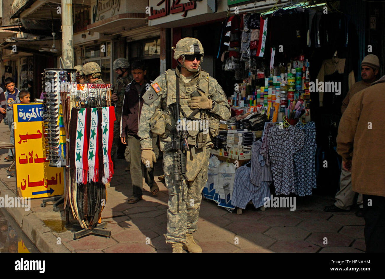 Sgt. 1st Class Brian Flading, 3rd Platoon sergeant of Killer Troop, 3rd Squadron, 3d Armored Cavalry Regiment from Fort Hood, Texas, walks through the busy Al Dawasa market in Mosul, Iraq, Feb. 9. 3d ACR visits a busy market in Mosul 76706 Stock Photo